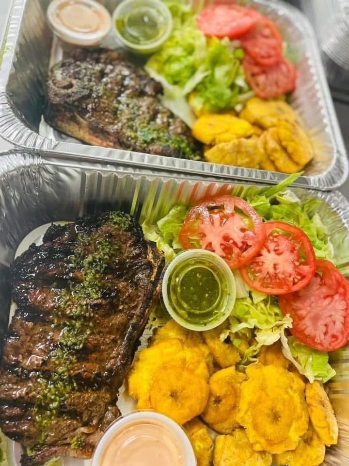 Steak, tostones and salad prepared for catering